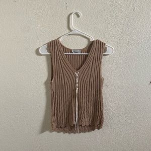Beige tank top with white ribbon braided in the middle